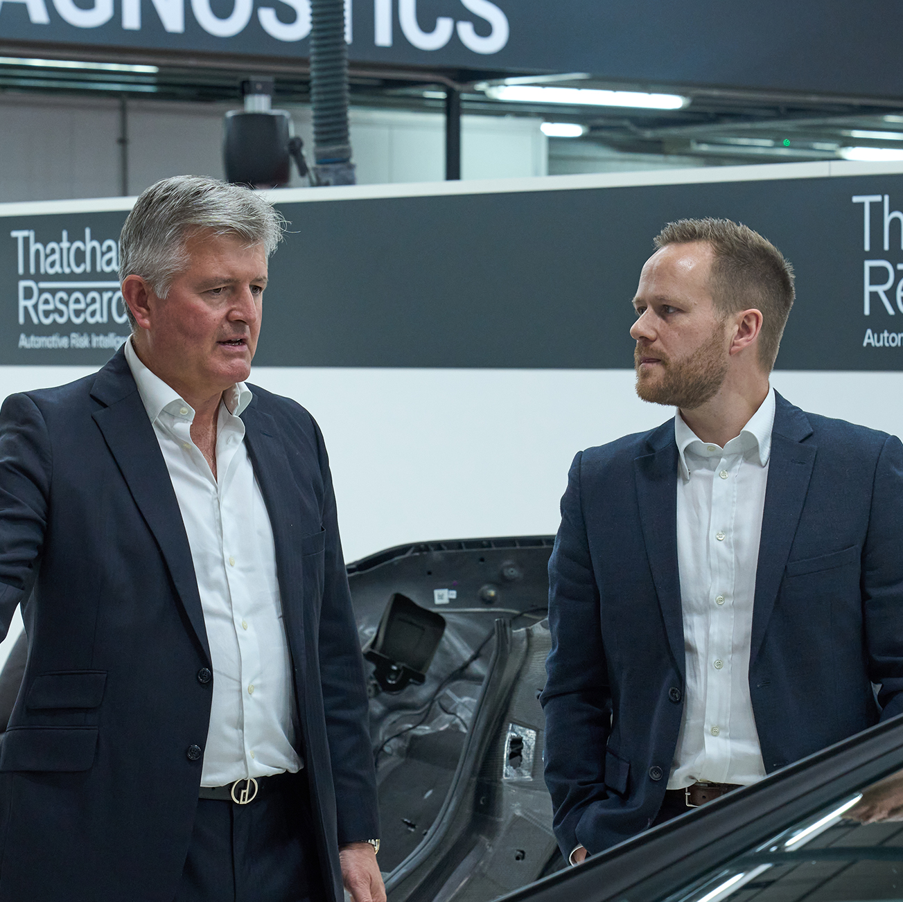 Jonathan Hewett, Thatcham Research chief executive gives James Burton, UK MD LexisNexis Risk Solutions, a tour of the Repair Technology Centre